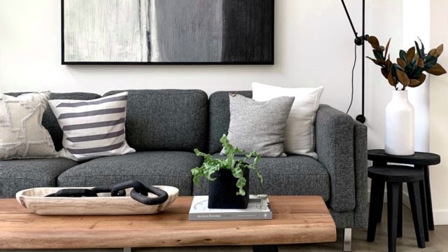 black and white throw pillows on gray couch